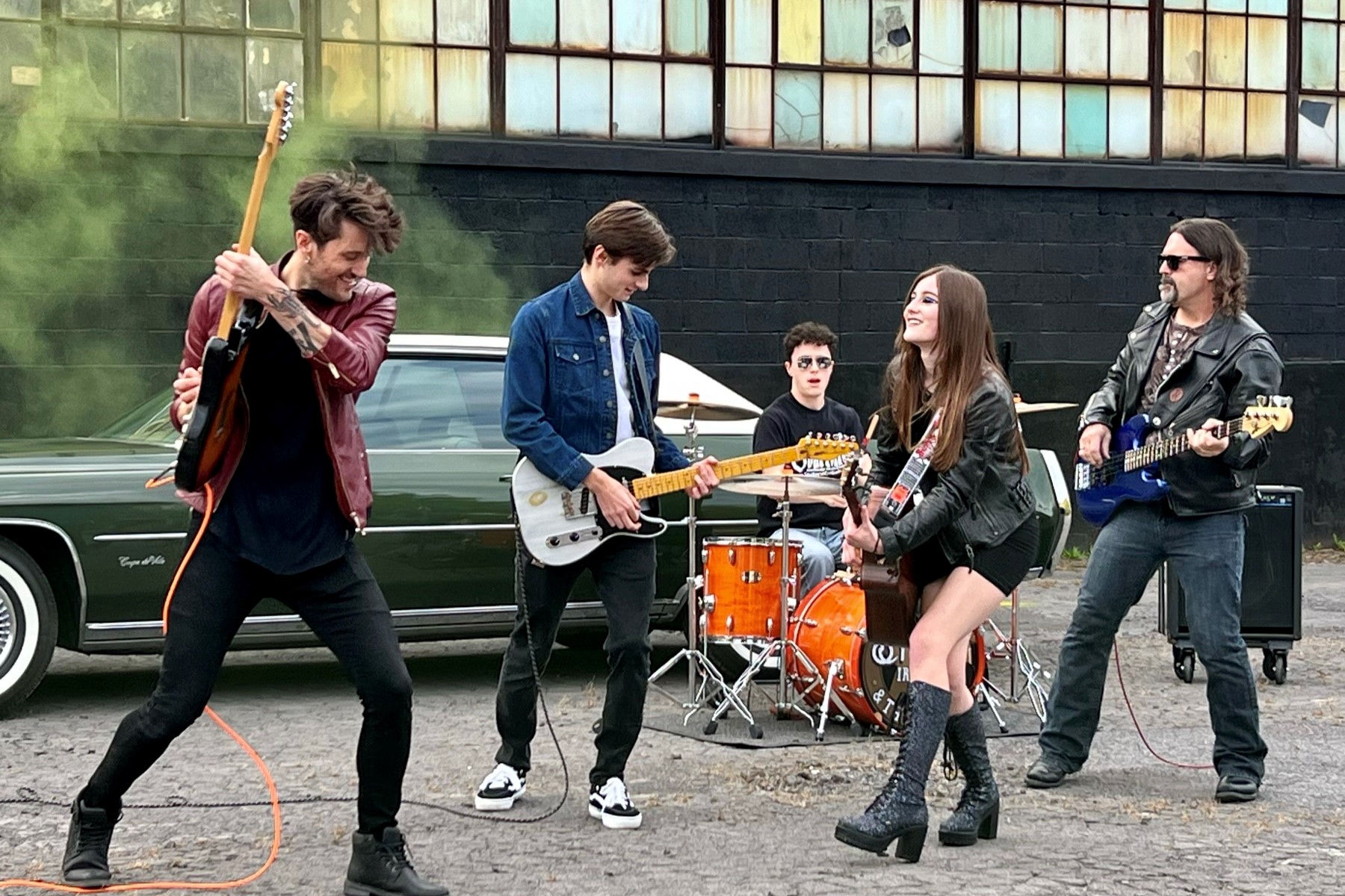 sydney irving band photo performing in front of a warehouse